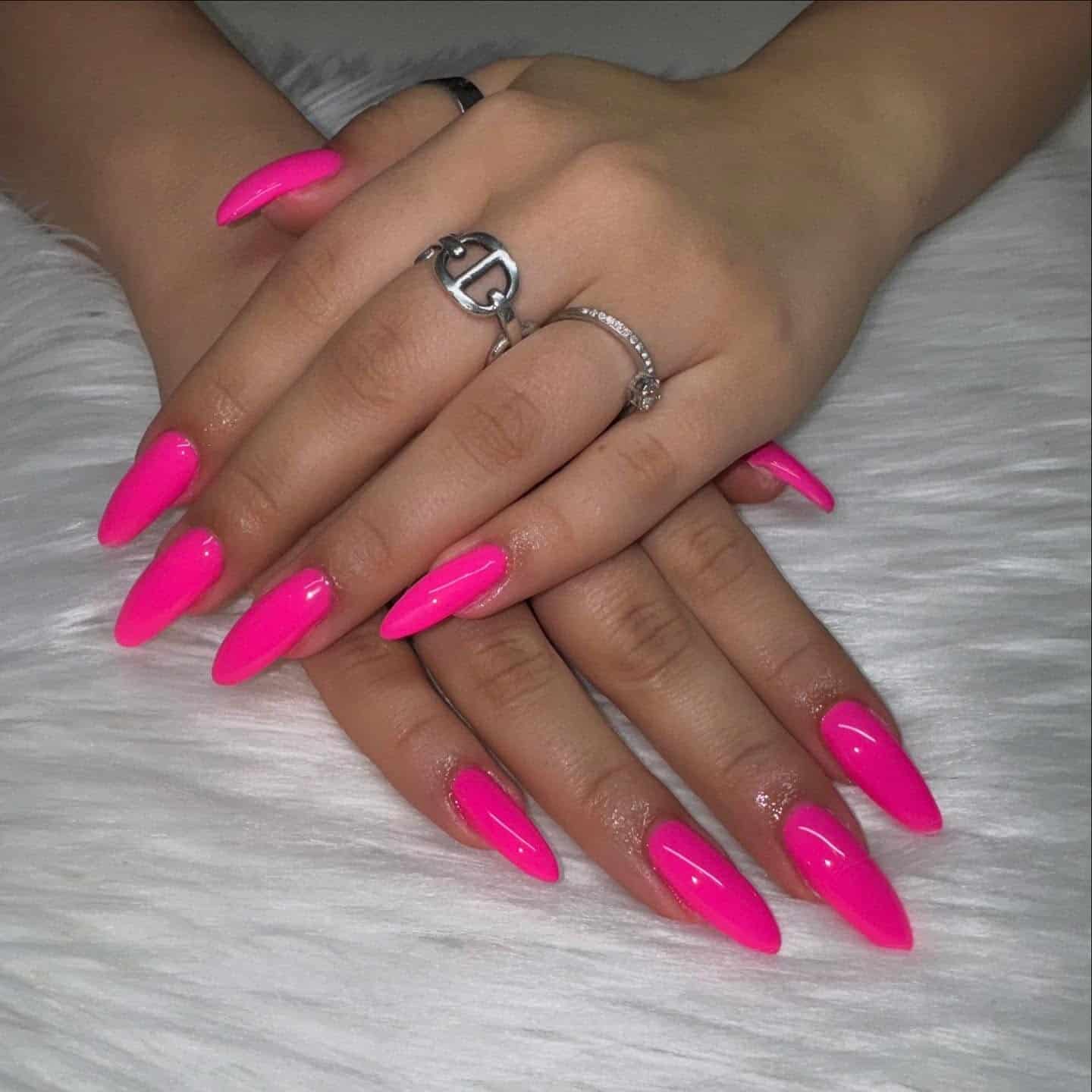 2. Extra-Long Neon Pink Stiletto Almond Nails - hot pink almond nail ideas