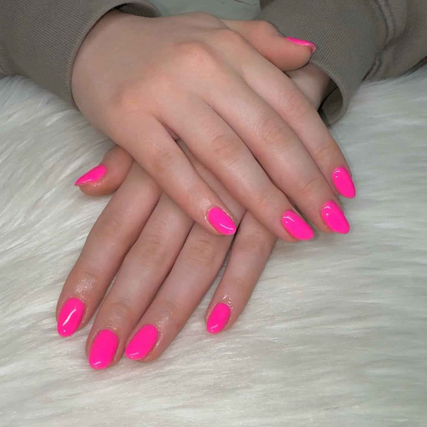 16. Classic Glossy Pink Almond Nails - hot pink almond nail ideas