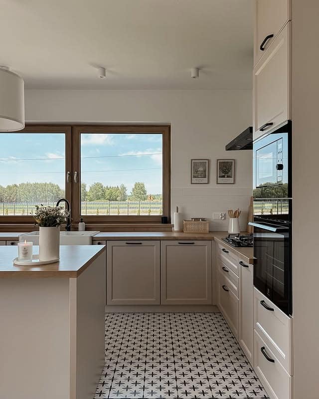 1. Soft Beige Shaker Kitchen with Patterned Tile Flooring - beige kitchen ideas