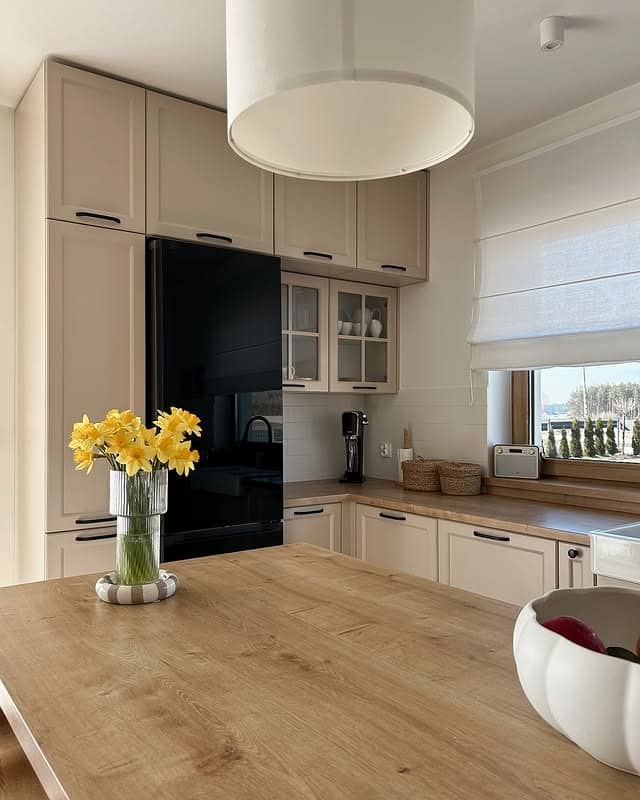 12. Classic Beige Shaker Kitchen with Oak Countertops - beige kitchen ideas