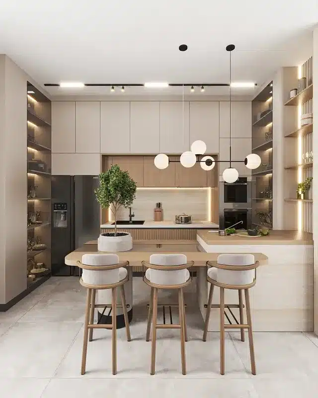 15. Symmetrical Beige Kitchen with Open Shelving and Globe Lighting - beige kitchen ideas