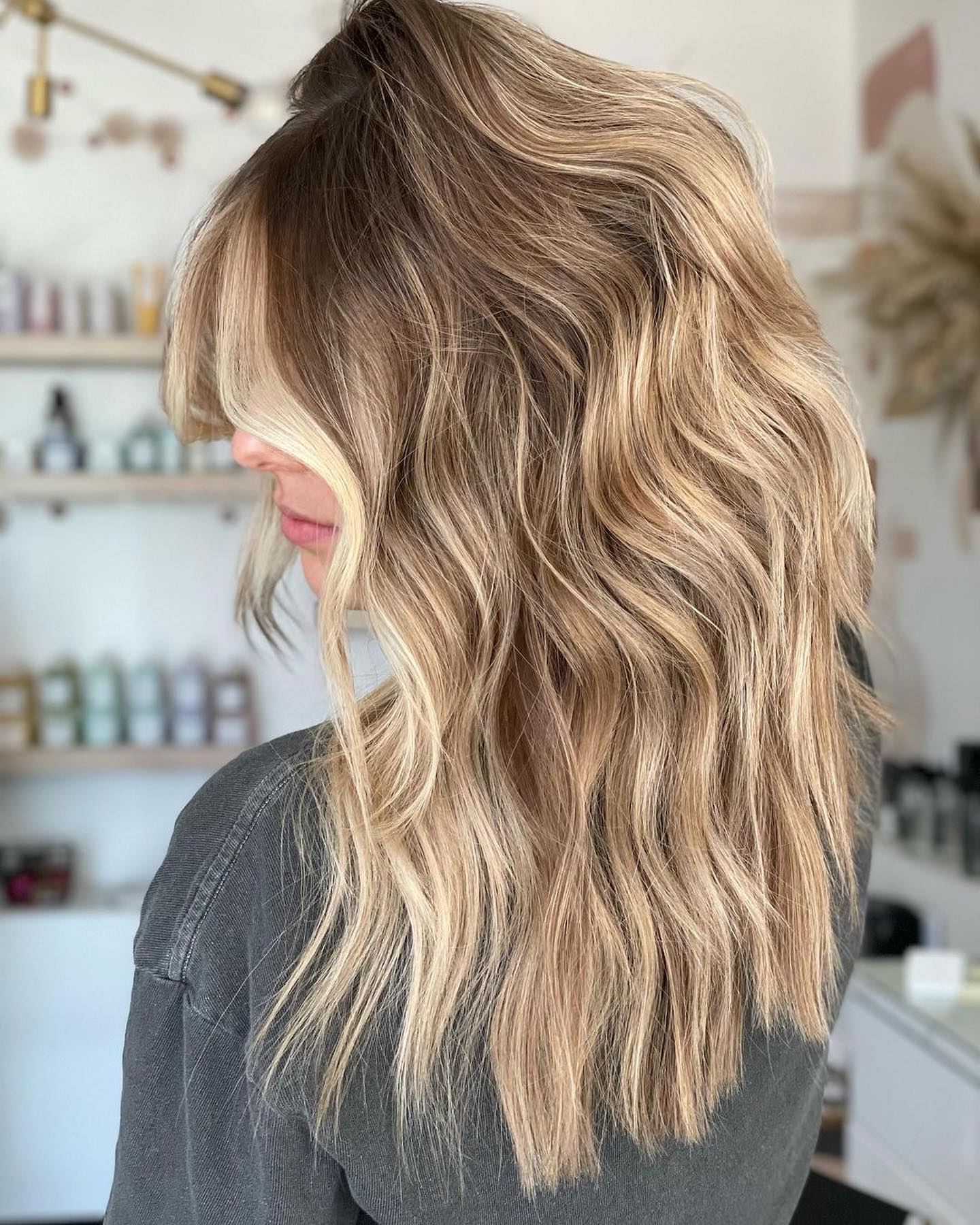 7. Sandy Blonde Shag with Curtain Fringe - Fall Blonde Hair Color