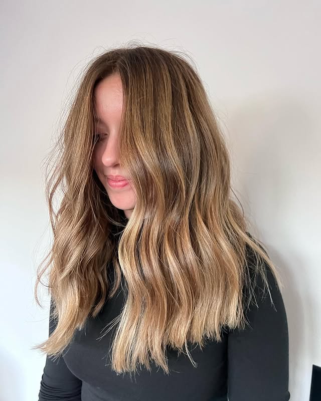 9. Honey Blonde Blowout with Soft Curtain Layers - Fall Blonde Hair Color