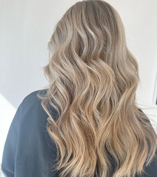 13. Sandy Cream Blonde with Cascading Layers - Fall Blonde Hair Color