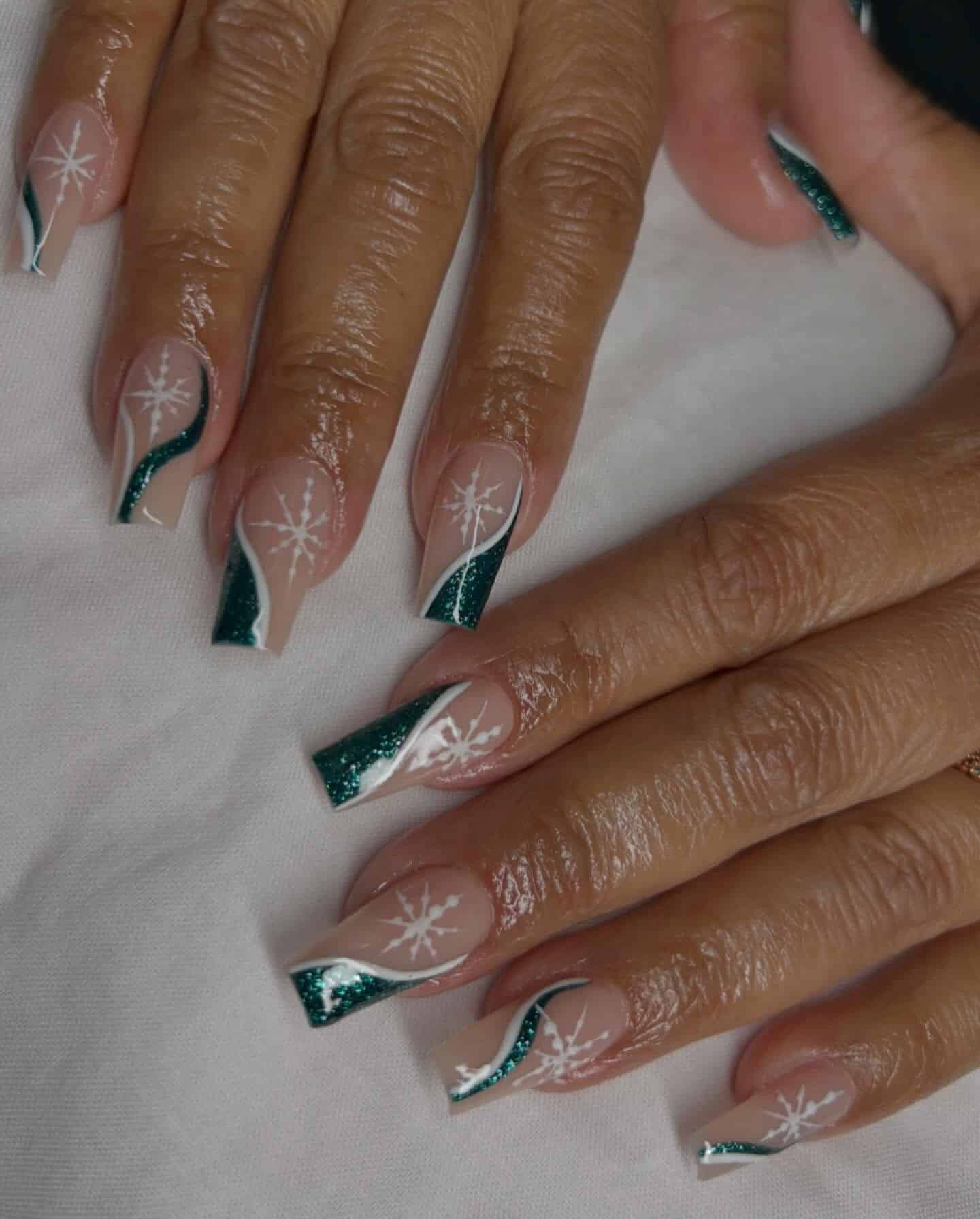 5. Hunter Green Glitter French with Snowflake Art - hunter green nail ideas