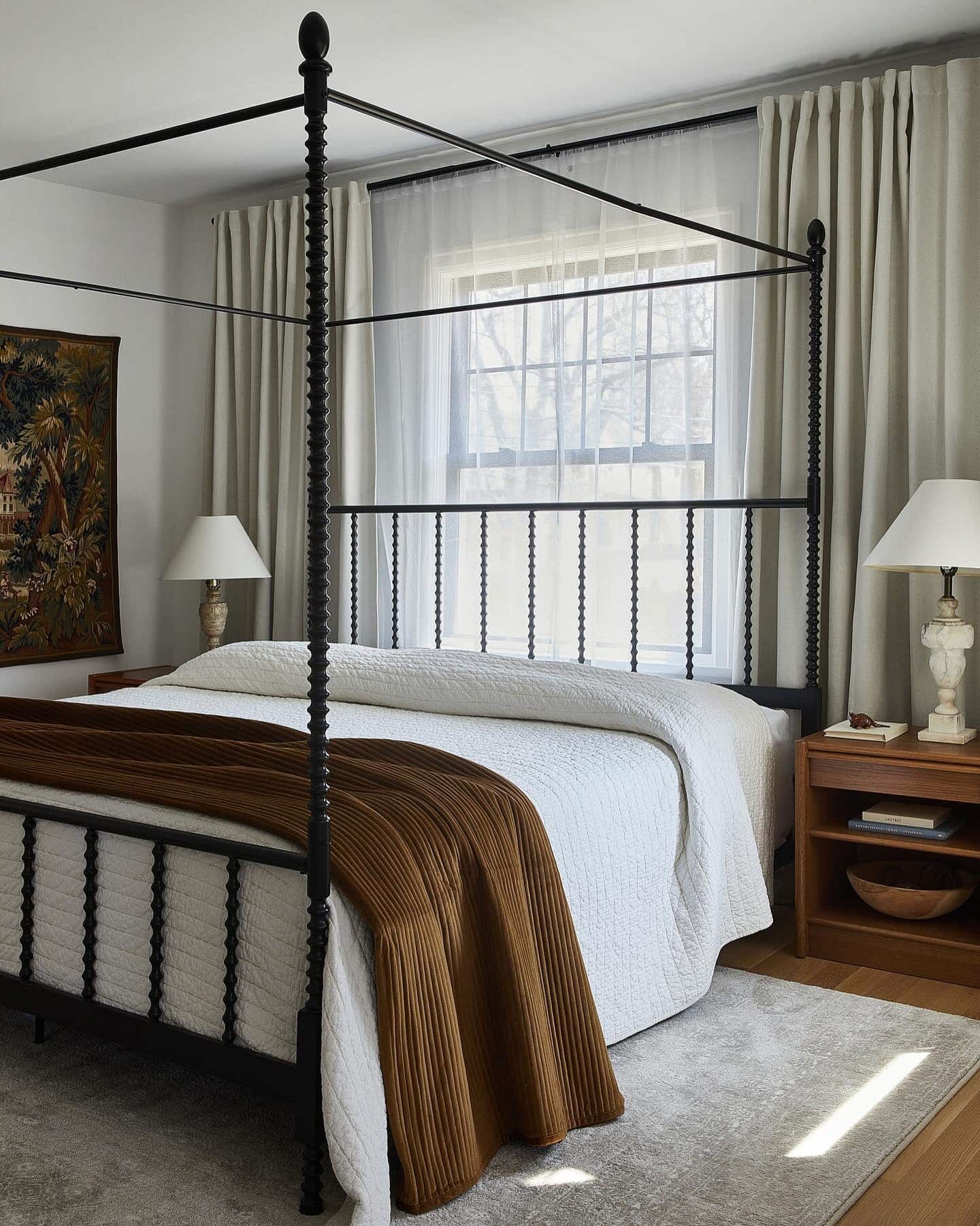 13. Black & Warm Walnut Four-Poster Sunroom - sunroom bedroom ideas