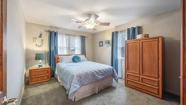 14. Sky Blue & Honey Oak Casual Sunroom Bedroom - sunroom bedroom ideas