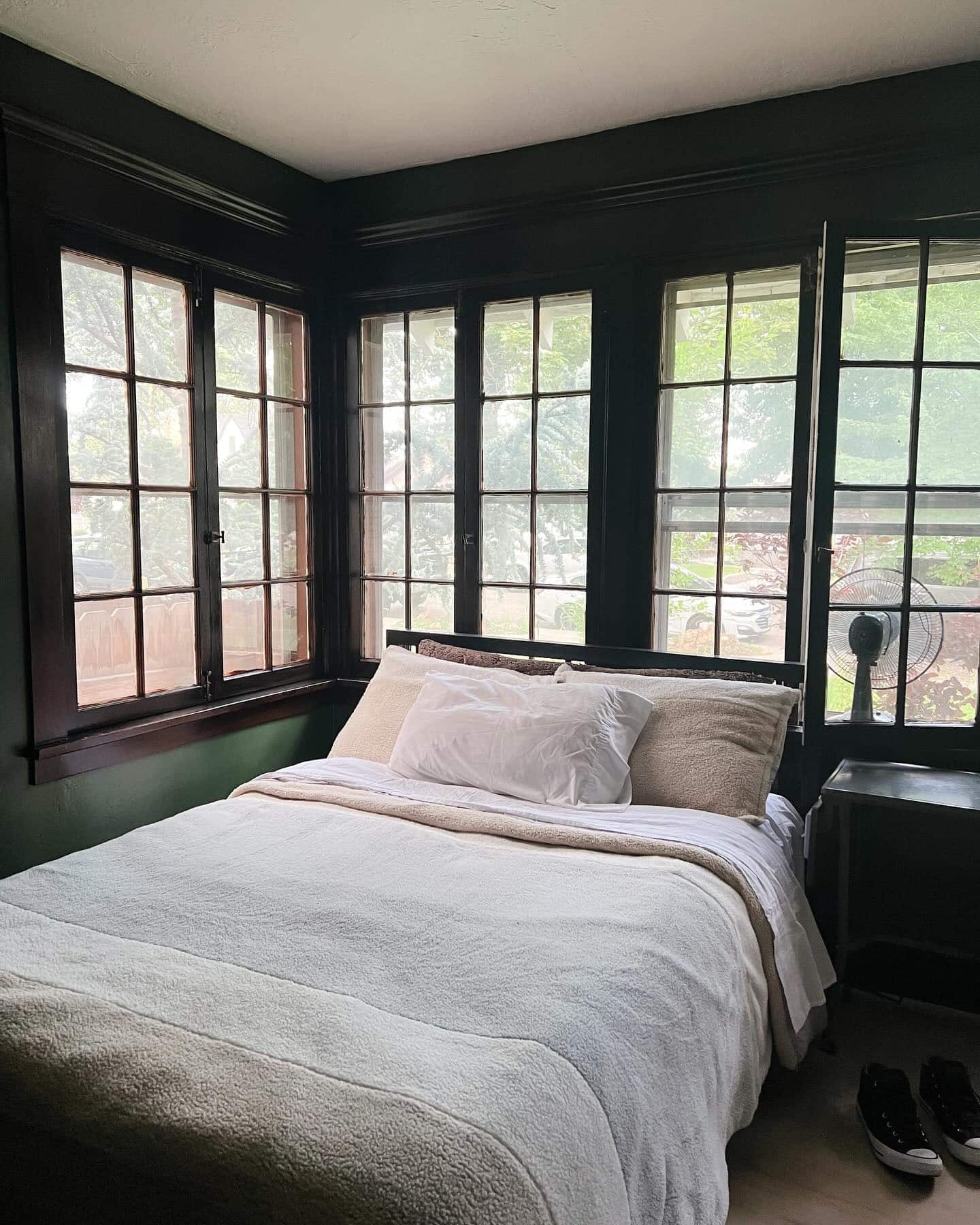 20. Deep Forest Green & White Cozy Window-Wrapped Bedroom - sunroom bedroom ideas