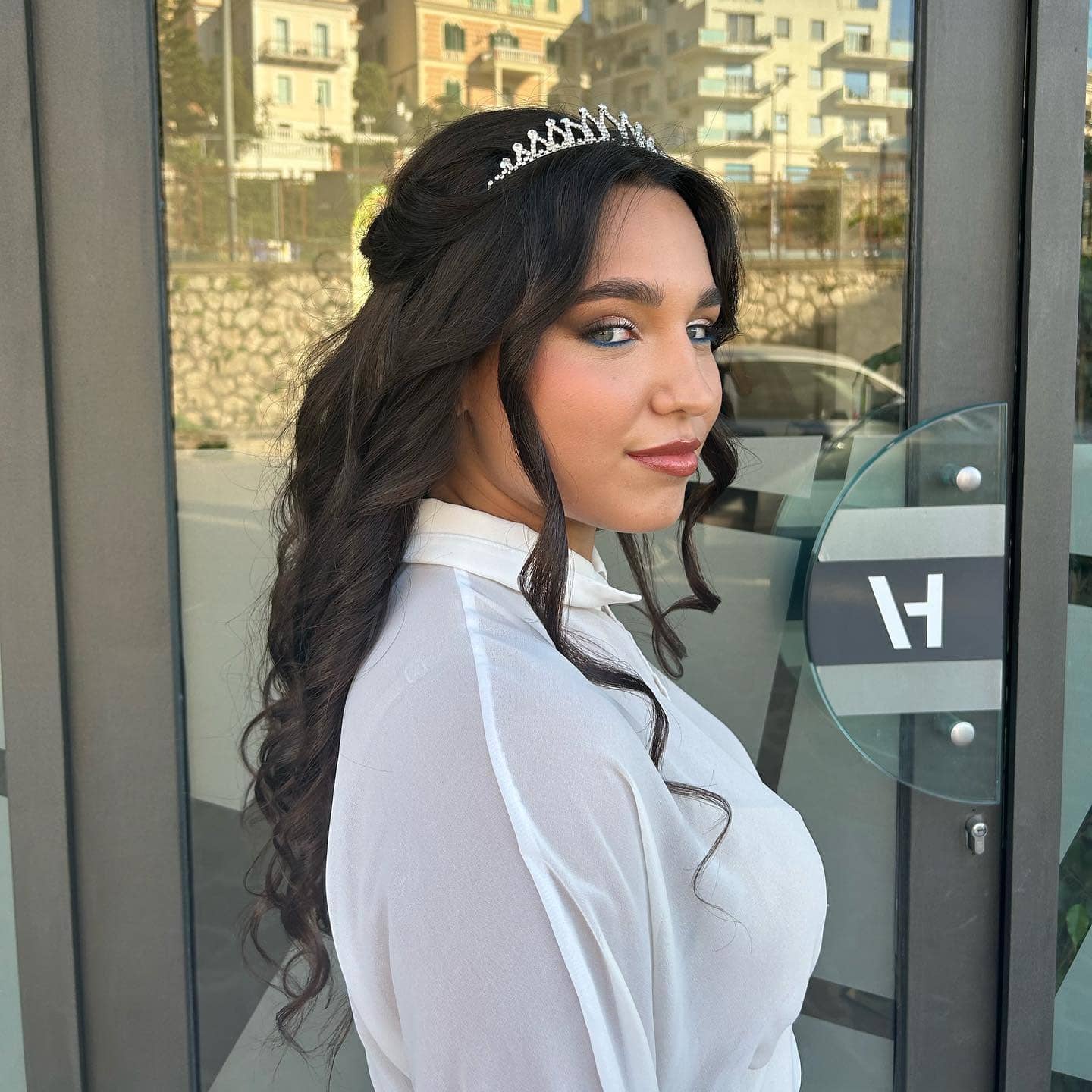 11. Deep Brunette Tiara Half-Up Waves - Birthday Hairstyles