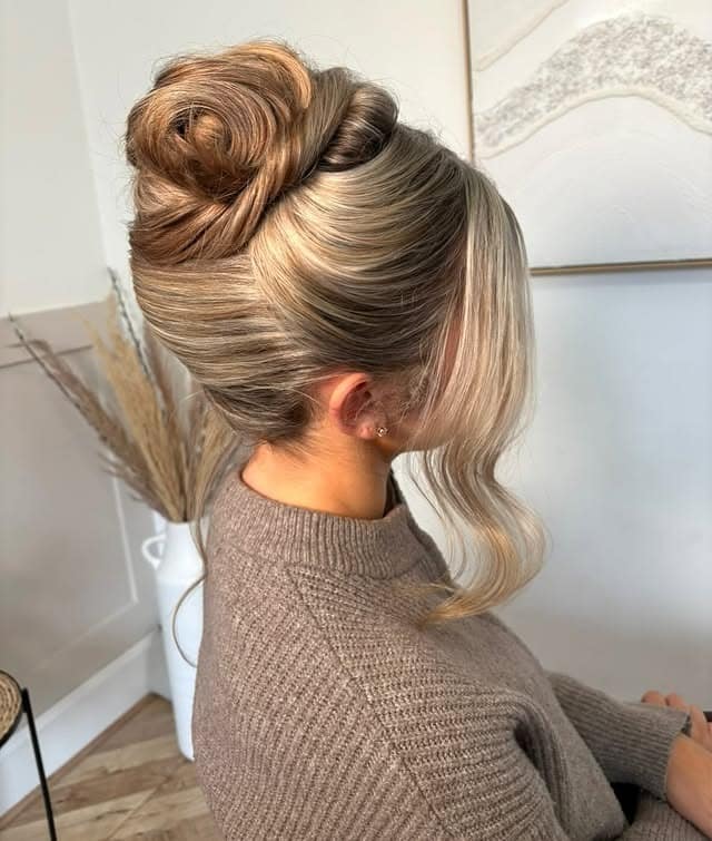 14. Ash Blonde Sleek High Bun with Face-Framing Pieces - Birthday Hairstyles