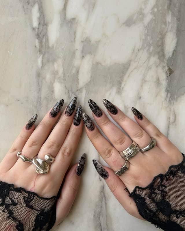 1. Black Lace Stiletto Nails with Smoky Sheer Base - lace nail ideas