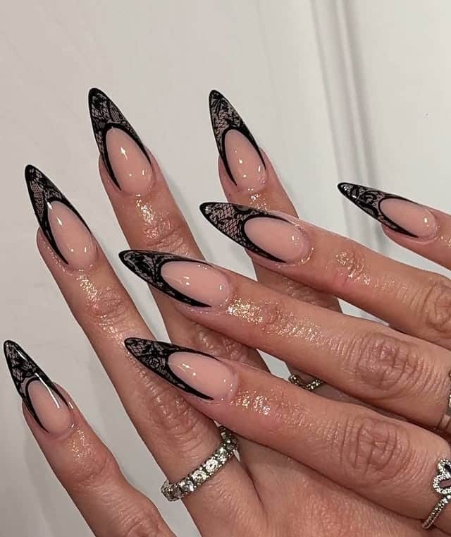 3. Sheer Nude Stiletto Nails with Black Lace French Tips - lace nail ideas