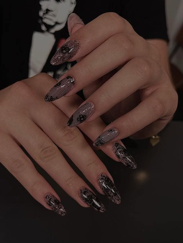 10. Sheer Black Lace Stiletto Nails with Floral Detailing - lace nail ideas