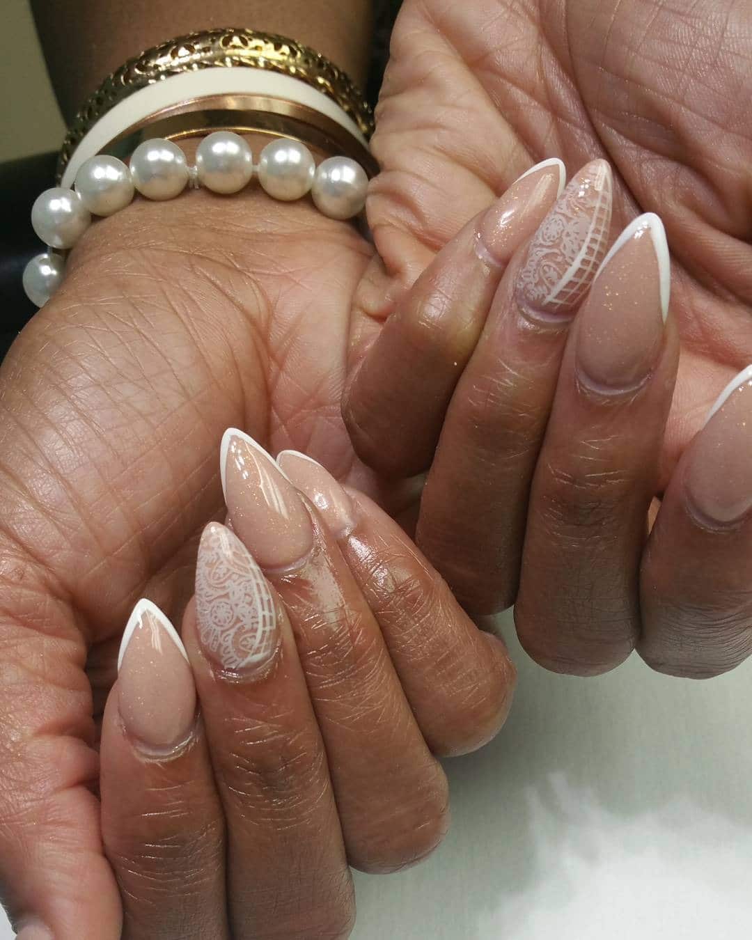 16. Nude Glitter Almond Nails with White Lace Detail - lace nail ideas