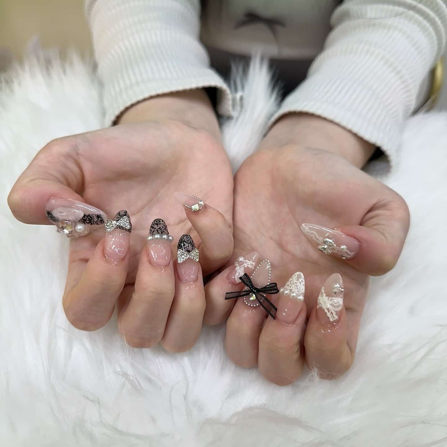 21. 3D Embellished Nude Stiletto Nails with Black and White Lace - lace nail ideas