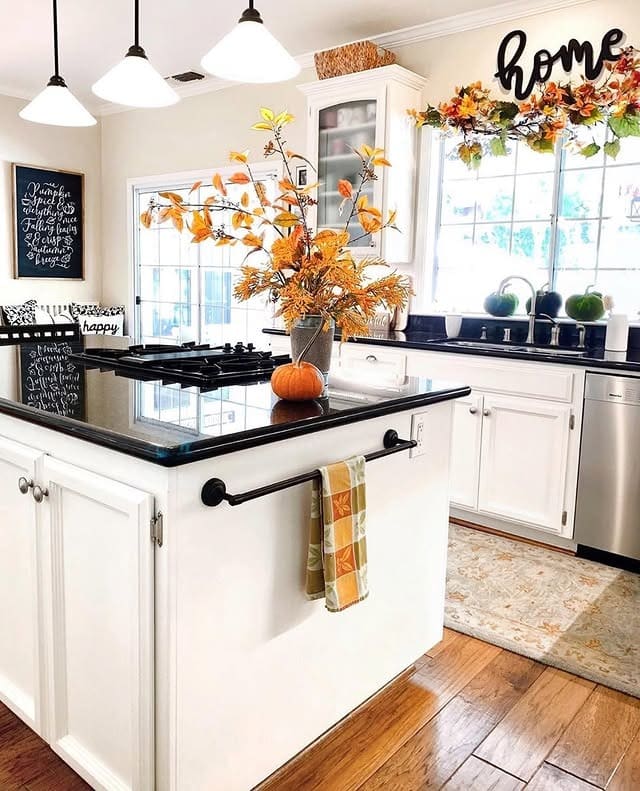 1. Classic White Kitchen with Black Granite and Autumn Accents - fall kitchen decor ideas