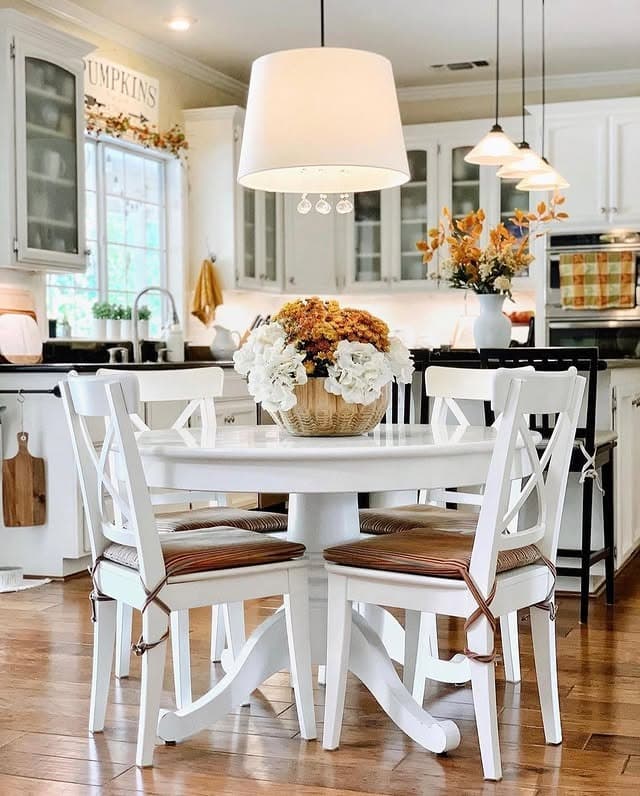2. Soft White Breakfast Nook with Pumpkin Spice Florals - fall kitchen decor ideas