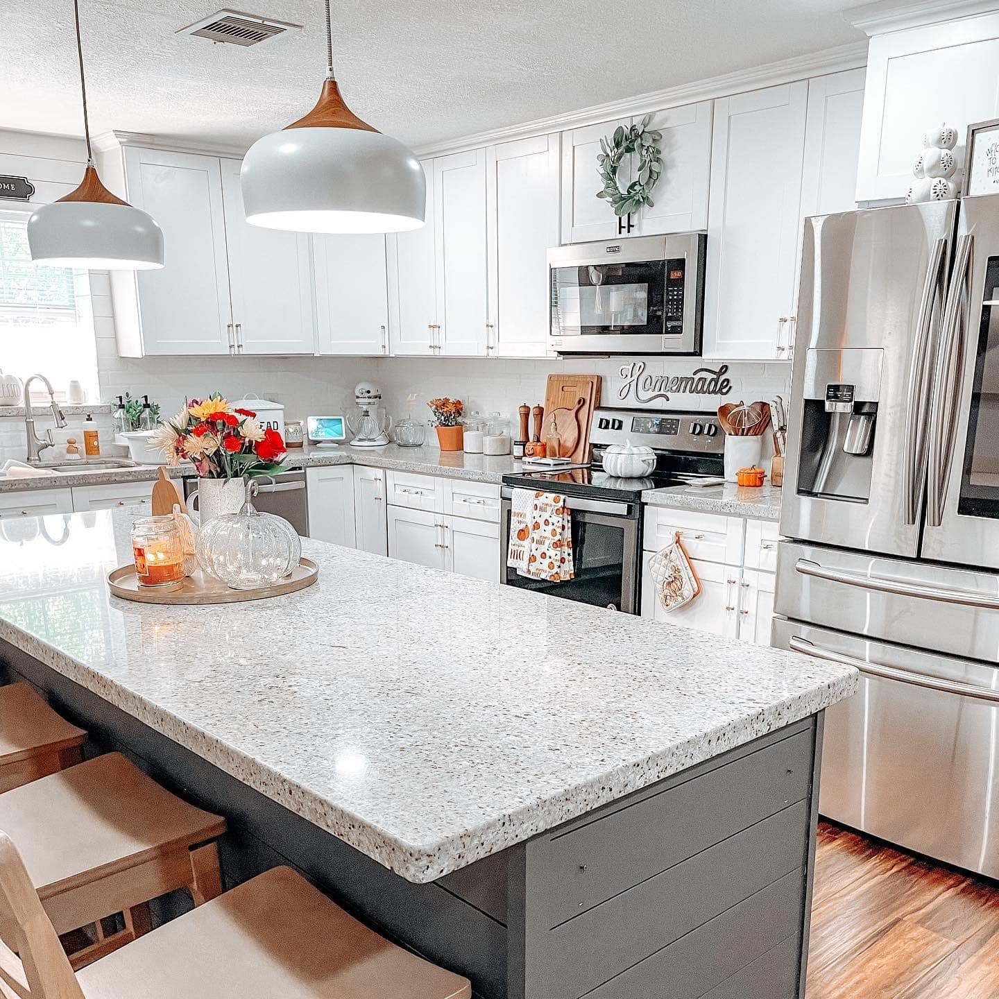 6. Contemporary White Kitchen with Subtle Harvest Details - fall kitchen decor ideas
