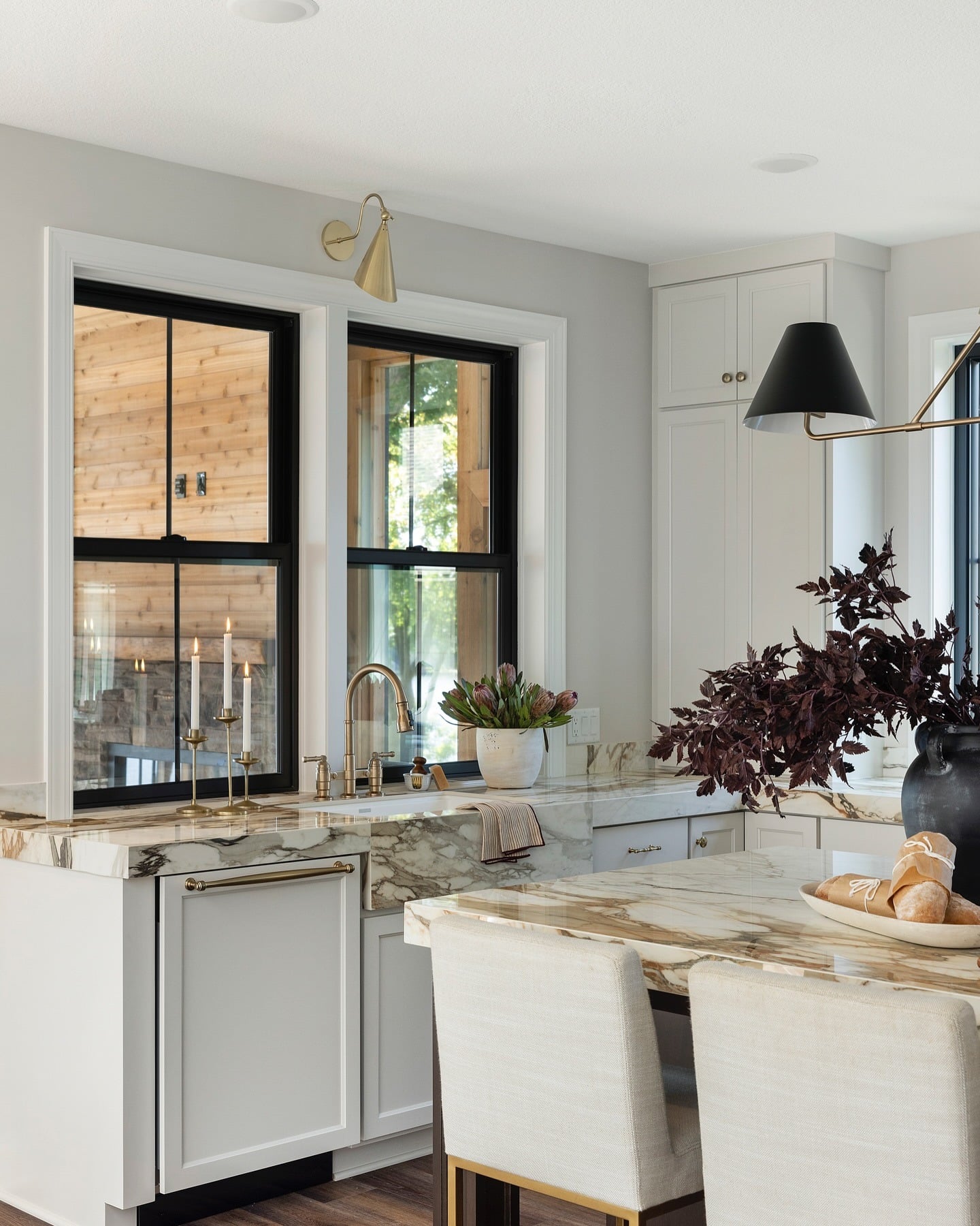 11. Marble and Brass Kitchen with Deep Burgundy Fall Accents - fall kitchen decor ideas