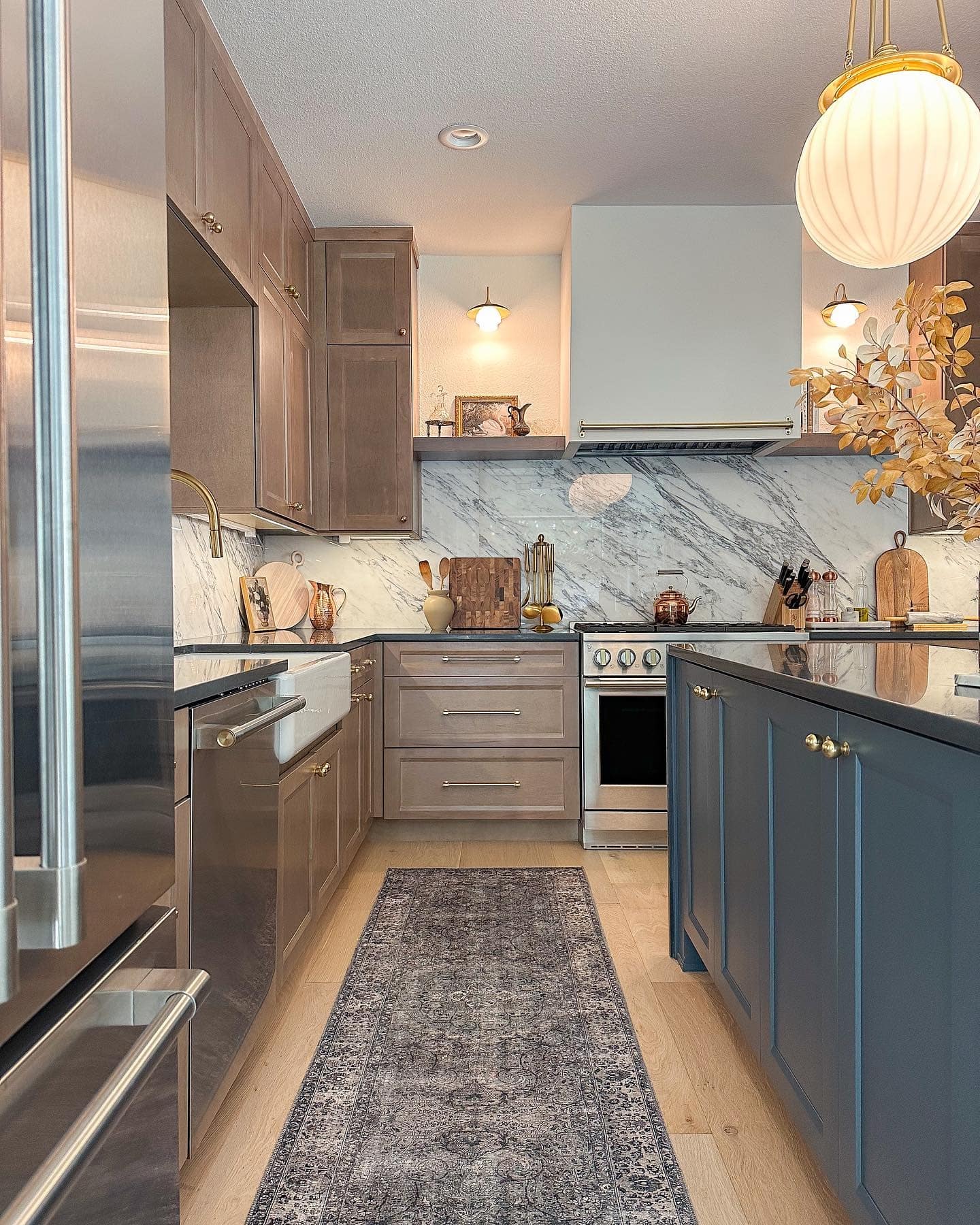 14. Taupe and Navy Kitchen with Marble Backsplash and Warm Metallics - fall kitchen decor ideas