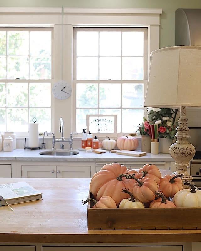17. Sage Green Kitchen with Soft Peach Pumpkins - fall kitchen decor ideas