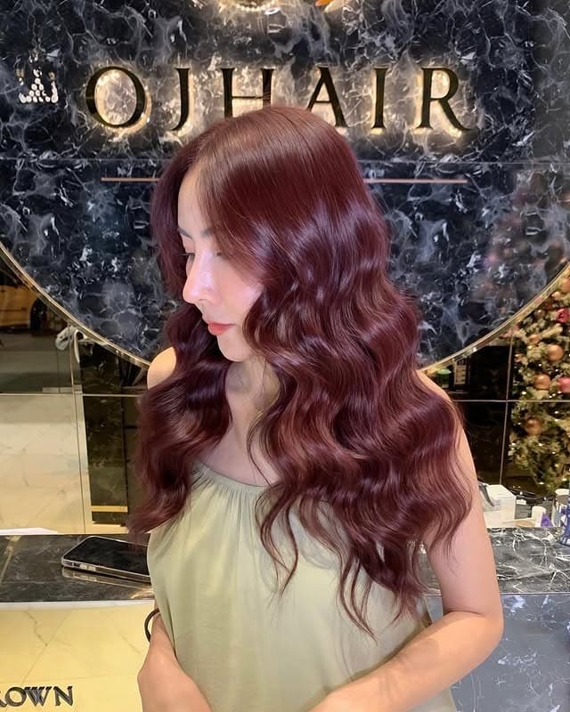 3. Vibrant Cherry Red-Brown with Glamour Waves - Cherry Brown Hair Color