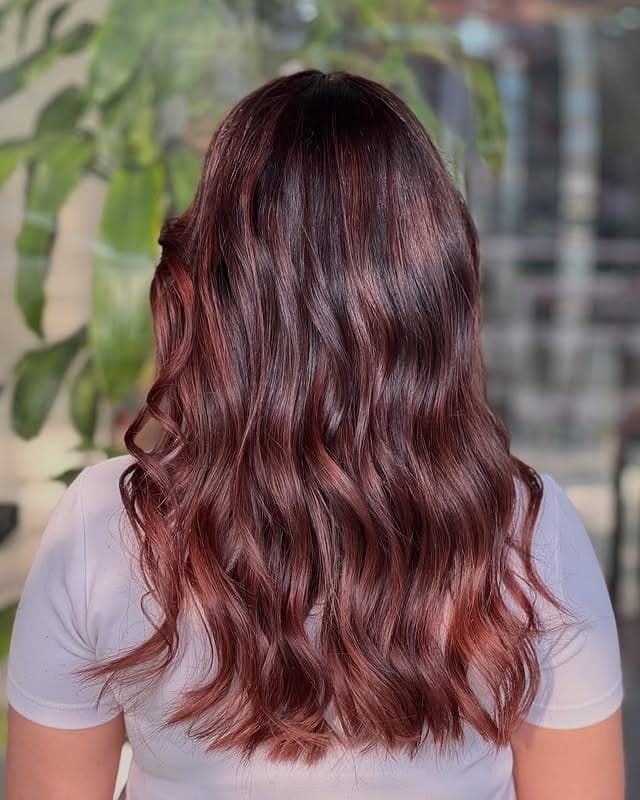 20. Copper-Kissed Cherry Brown with Natural Waves - Cherry Brown Hair Color