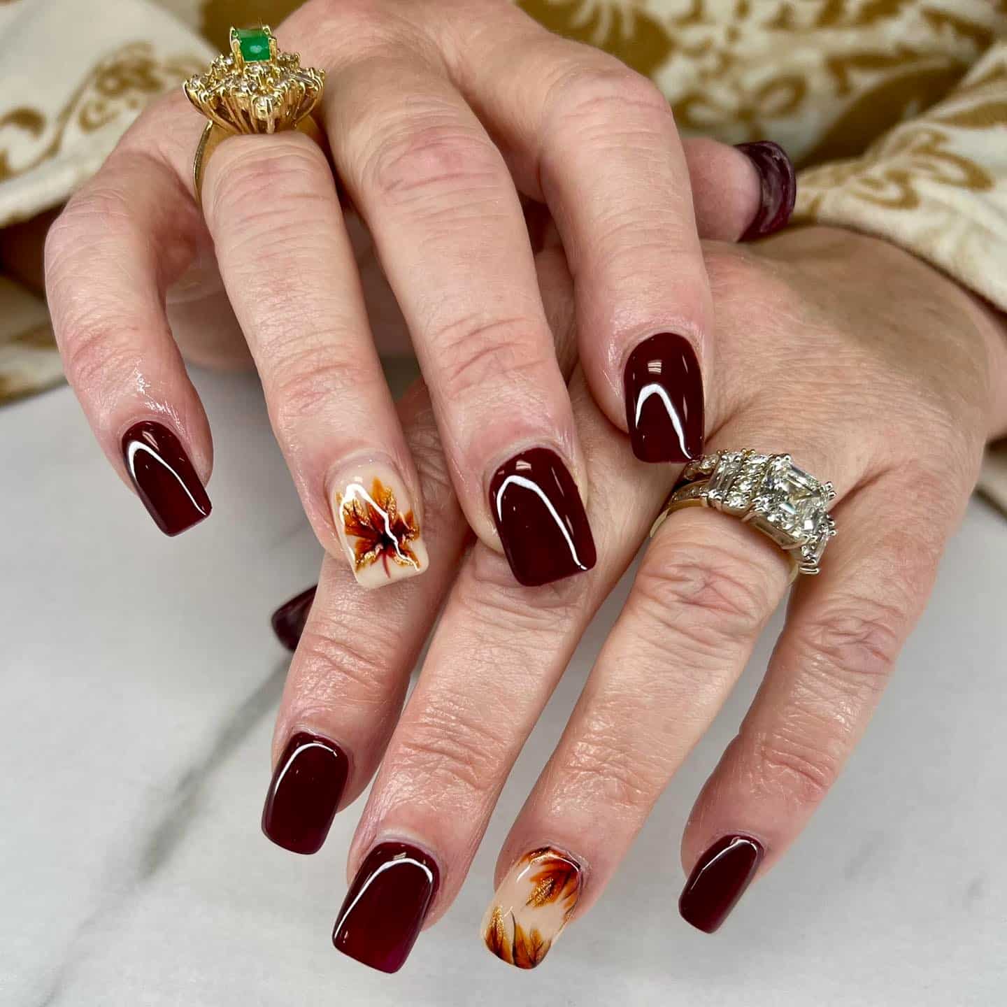 1. Deep Burgundy Gloss Nails with Autumn Leaf Accent - leaves nail ideas