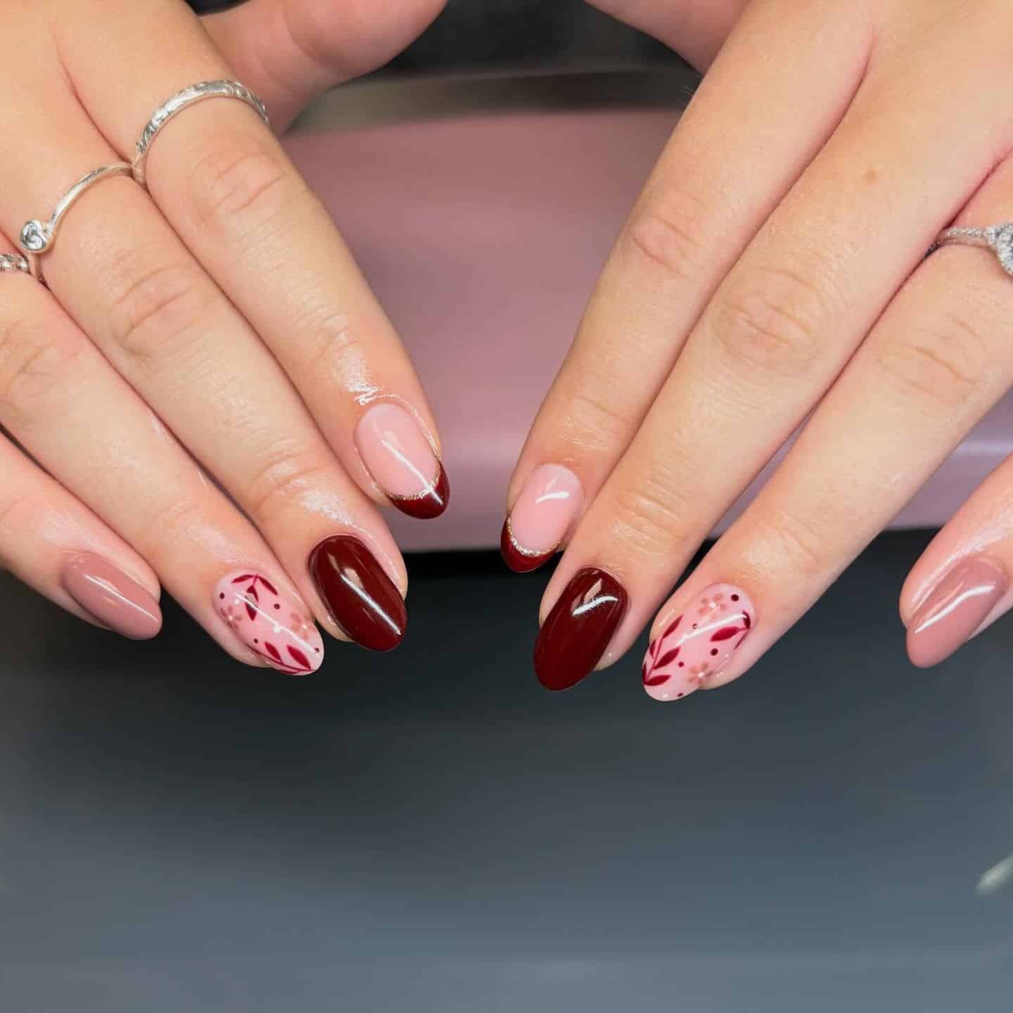 4. Burgundy Almond Nails with Botanical Dot and Leaf Accents - leaves nail ideas