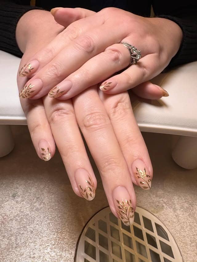 8. Sheer Nude Almond Nails with Gold Leaf Foil Detail - leaves nail ideas