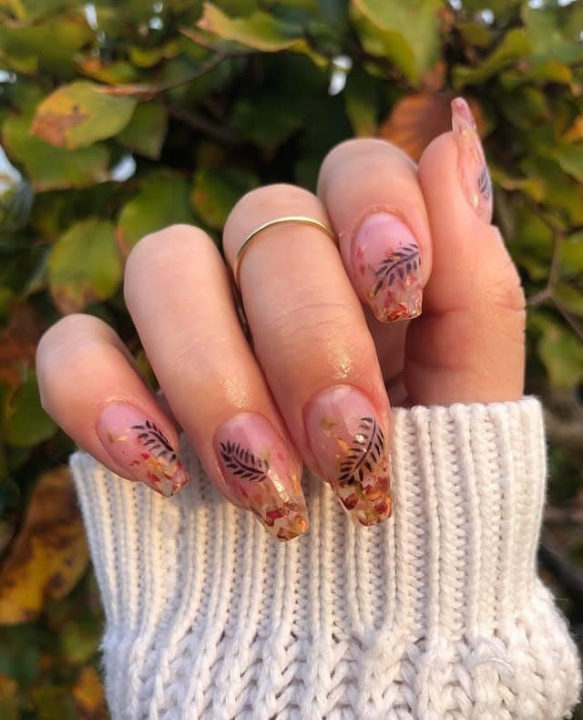 11. Clear Almond Nails with Autumn Leaf Confetti Tips - leaves nail ideas