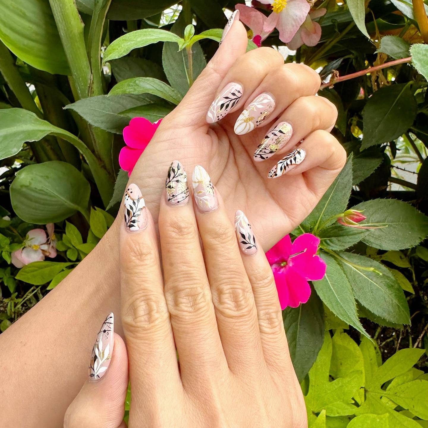 14. Botanical Garden Almond Nails with Neutral Base and Black Leaf Art - leaves nail ideas