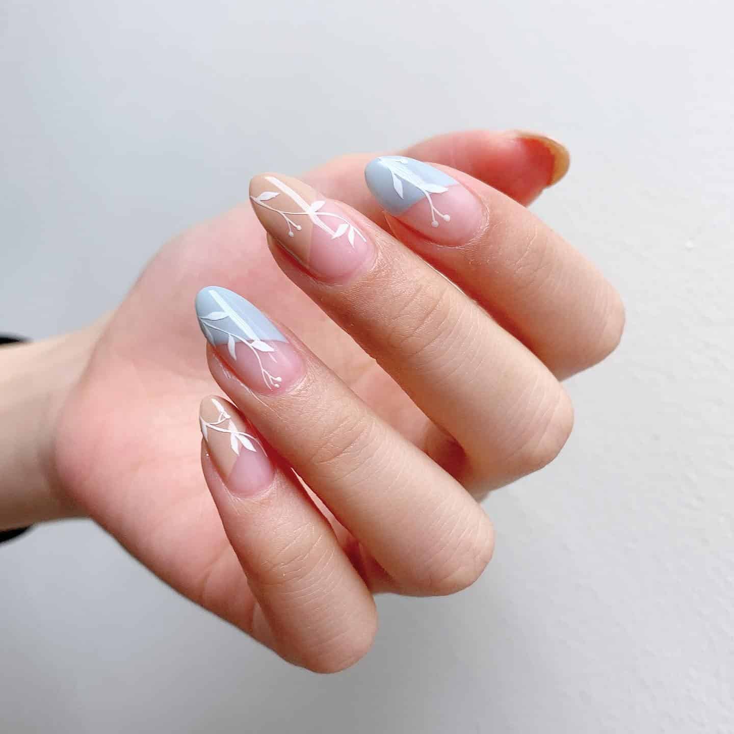 20. Soft Blue and Beige Almond Nails with White Leaf Branch Art - leaves nail ideas