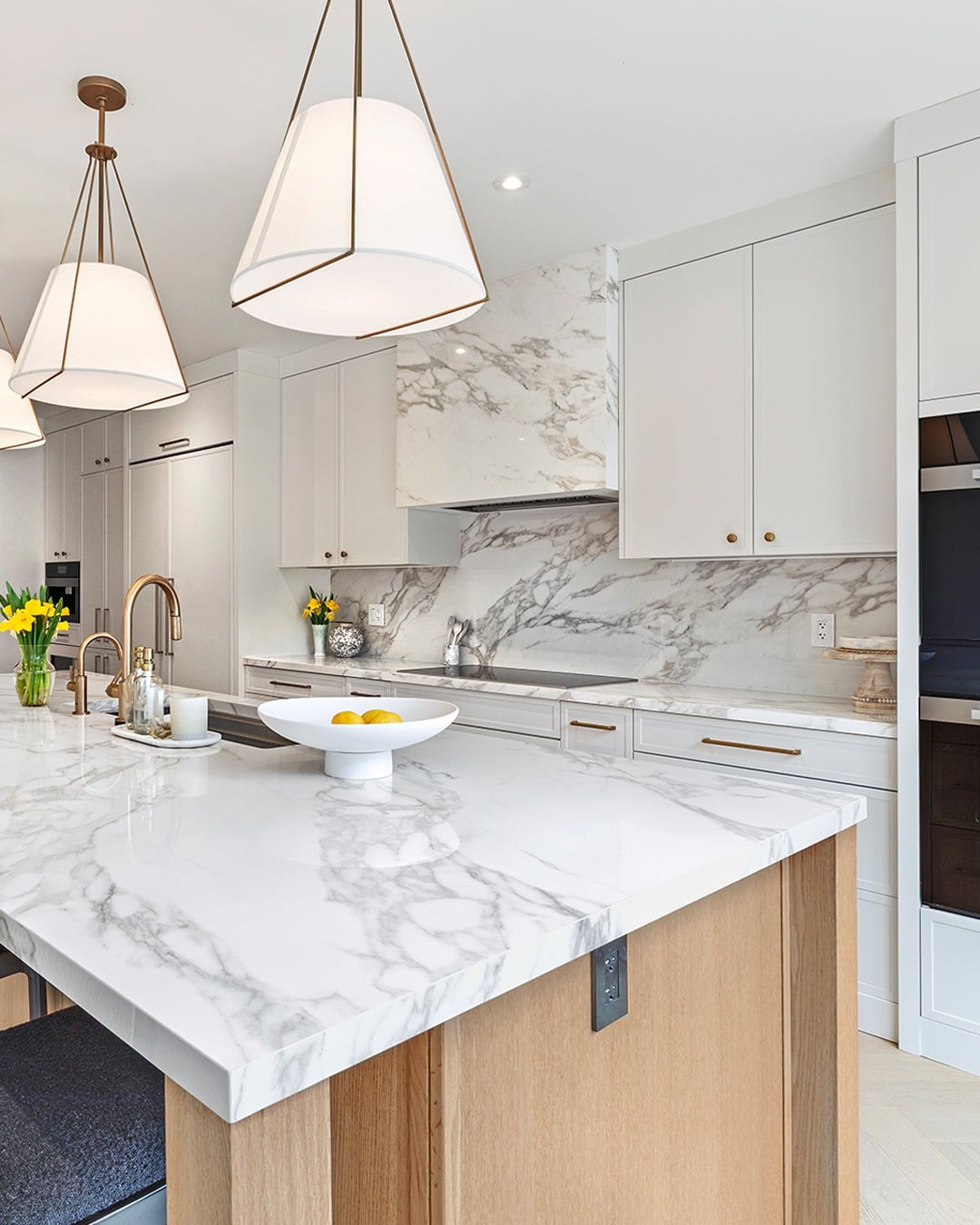 10. Bright Marble Kitchen with Brass Fixtures - modern kitchen ideas