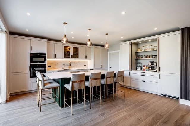 19. Soft Cream Kitchen with Green Island Accent - modern kitchen ideas