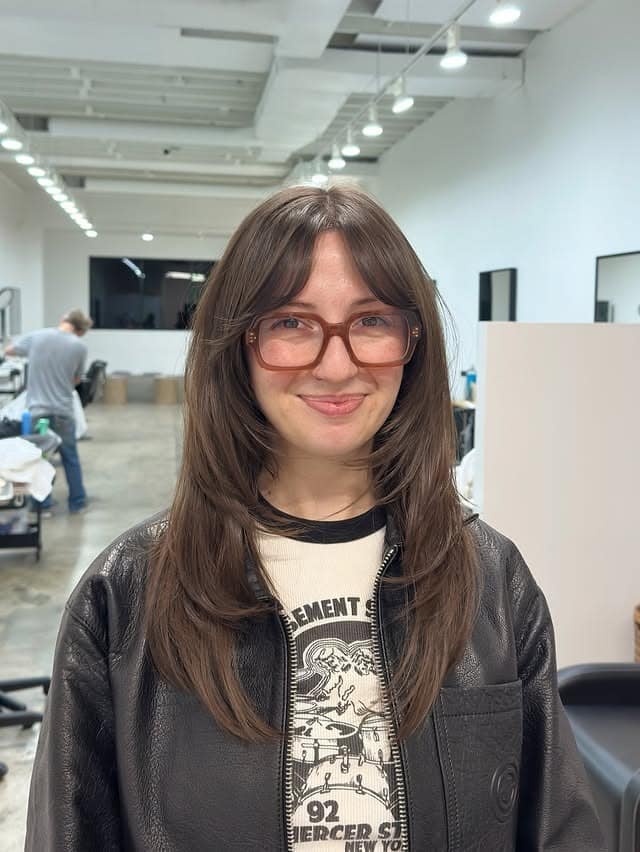 4. Textured Medium Shag with Natural Brunette Bangs - Medium Haircuts With Bangs