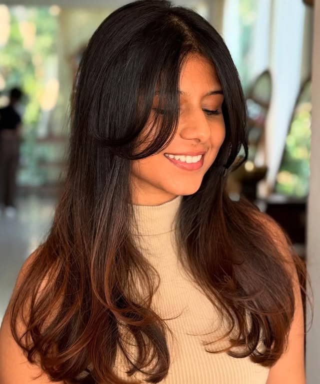 8. Soft Flowing Medium Layers with Warm Honey Blonde Bangs - Medium Haircuts With Bangs