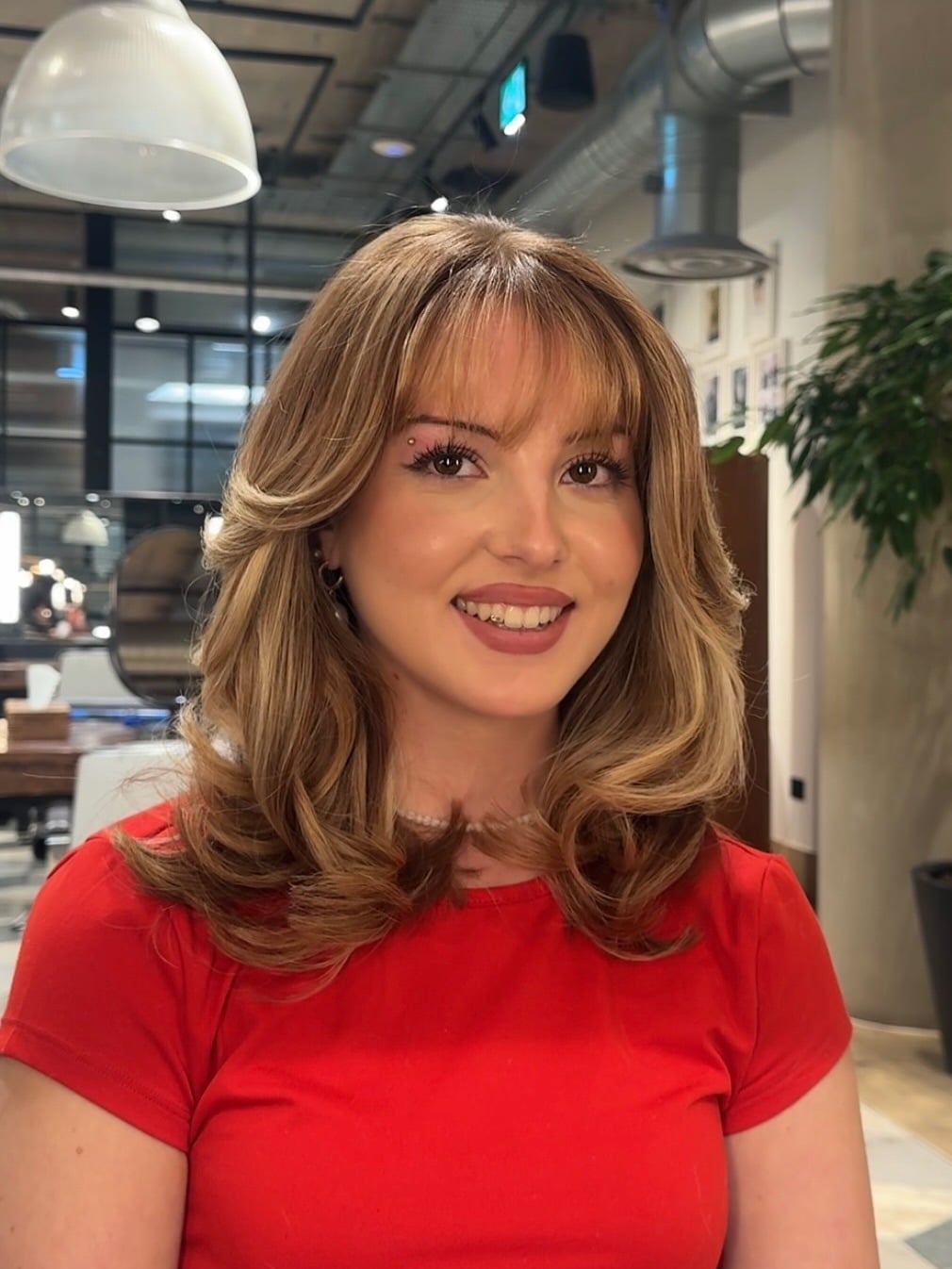 9. Classic Medium Layers with Rich Brunette Curtain Bangs - Medium Haircuts With Bangs