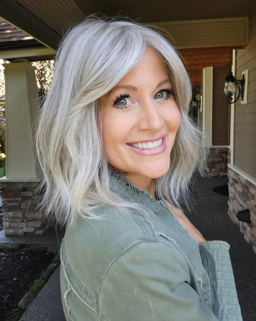10. Soft Shoulder-Length Layers with Silver Blonde Bangs - Medium Haircuts With Bangs