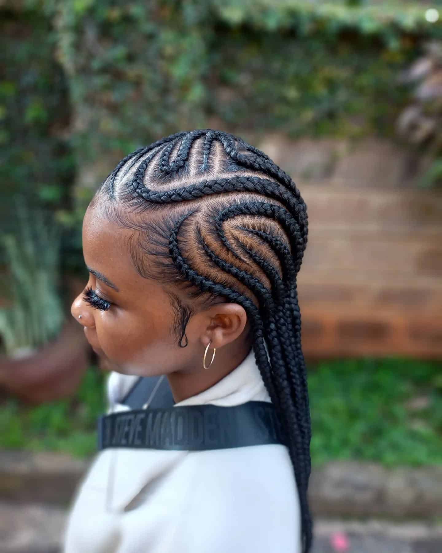 21. Curved Pattern Cornrow Braids in Natural Black - Cornrow Hairstyles