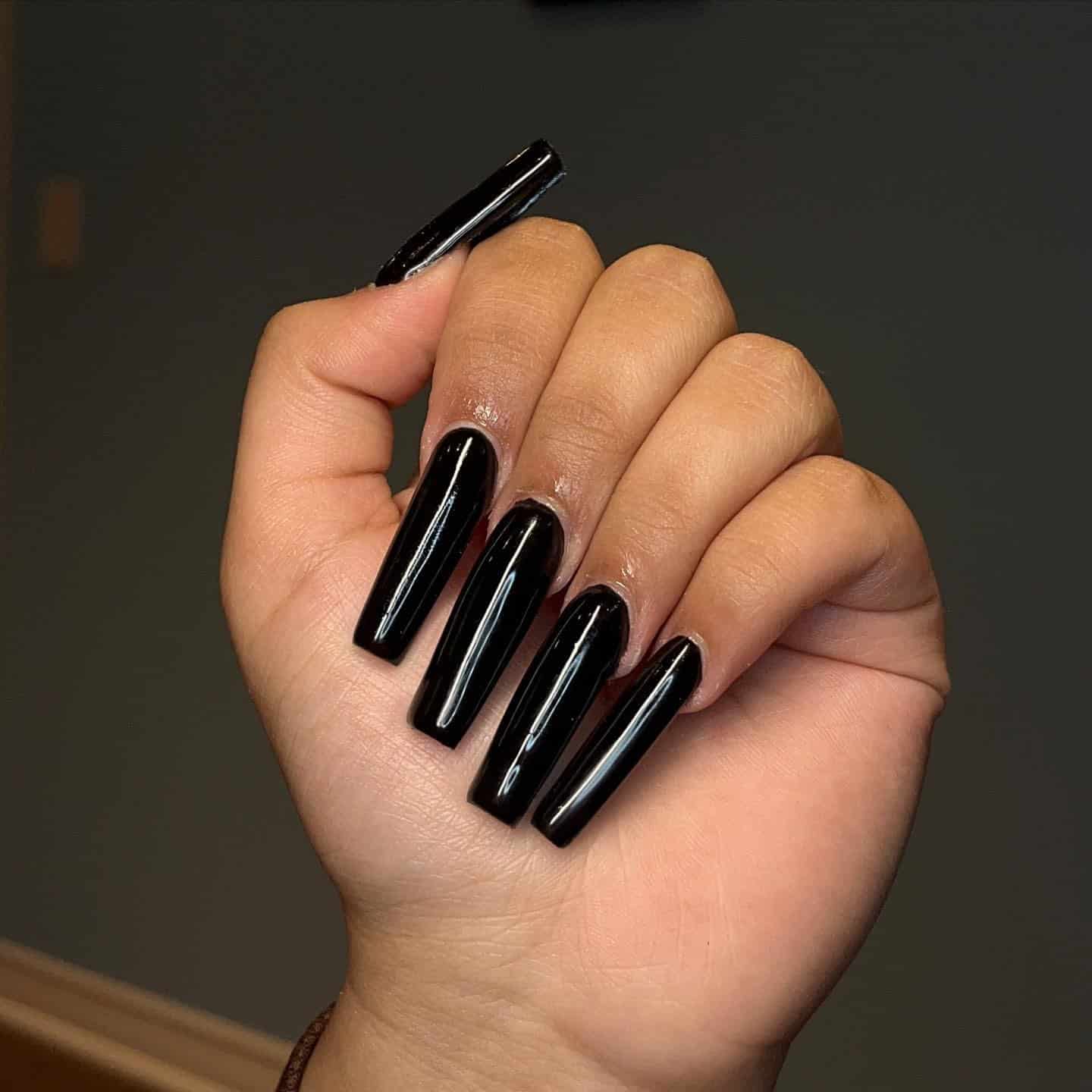 1. Glossy Jet Black Long Coffin Nails - long black nail ideas