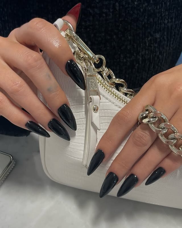 3. Sleek Black Almond-Stiletto Nails - long black nail ideas