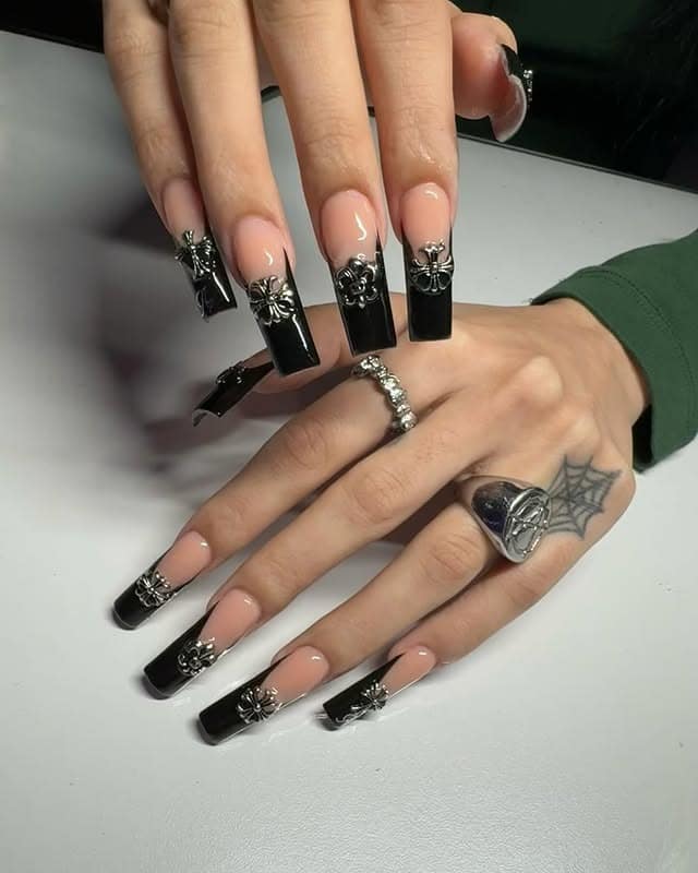 9. Nude Base Black French with Gothic Charms - long black nail ideas