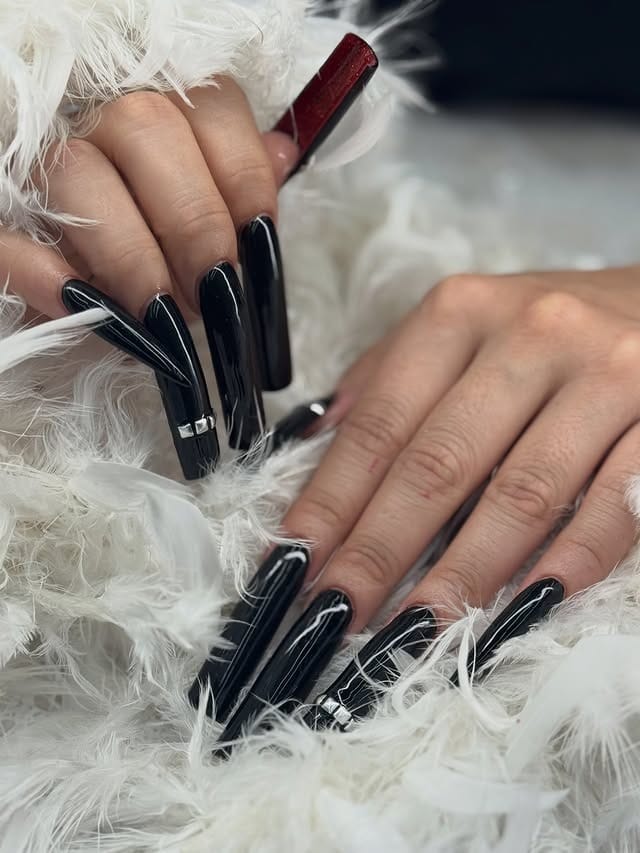 13. Ultra Glossy Black Coffin Nails with Accent Detail - long black nail ideas