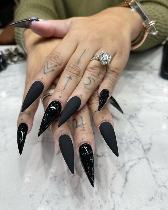 14. Matte and Glossy Black Stiletto Nail Mix - long black nail ideas