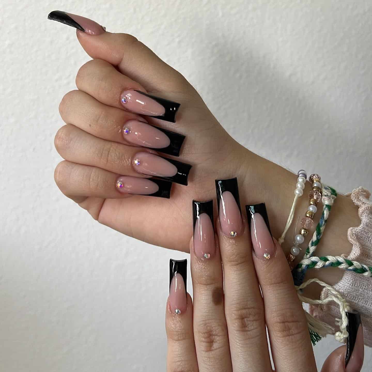 16. Nude and Black Long French Tip Nails with Rhinestones - long black nail ideas