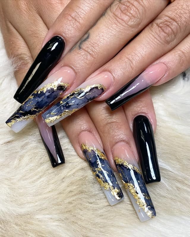 17. Black Marble Accent Long Coffin Nails with Gold Foil - long black nail ideas