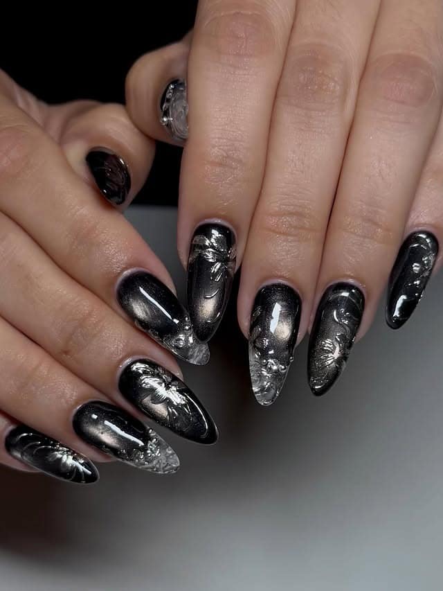 19. Metallic Black Chrome Almond Nails with 3D Accents - long black nail ideas