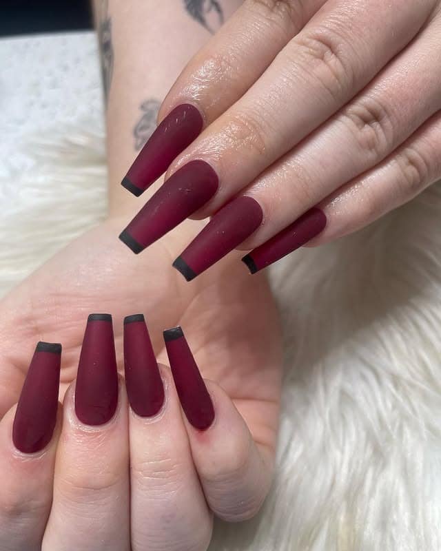 8. Matte Burgundy Coffin Nails with Dark French Tips - matte red nail ideas