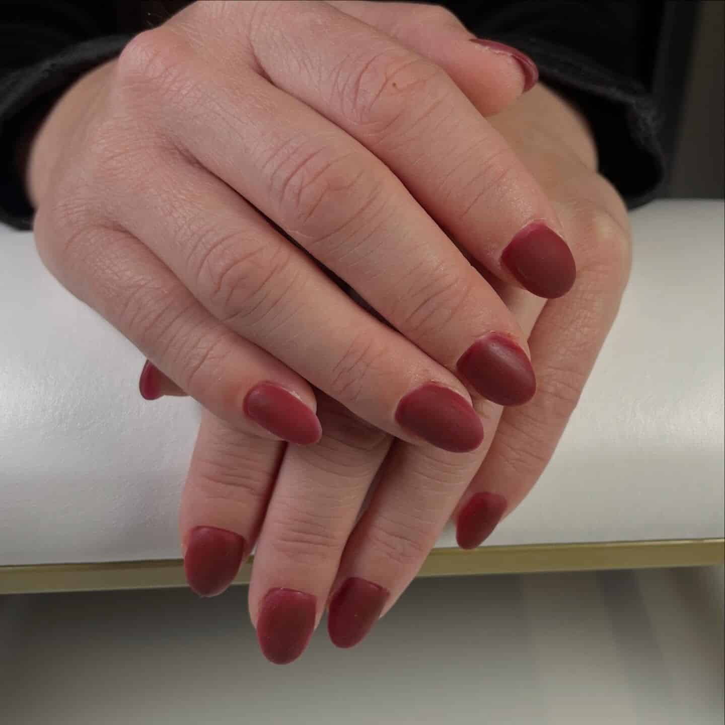 9. Matte Wine Red Short Almond Nails - matte red nail ideas